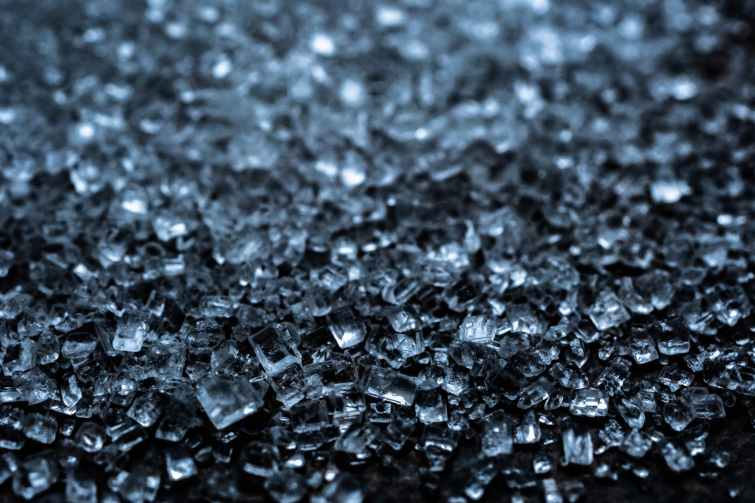 tiny pieces of broken glass in grayscale photography