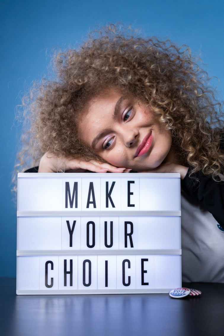 smiling woman with a sign