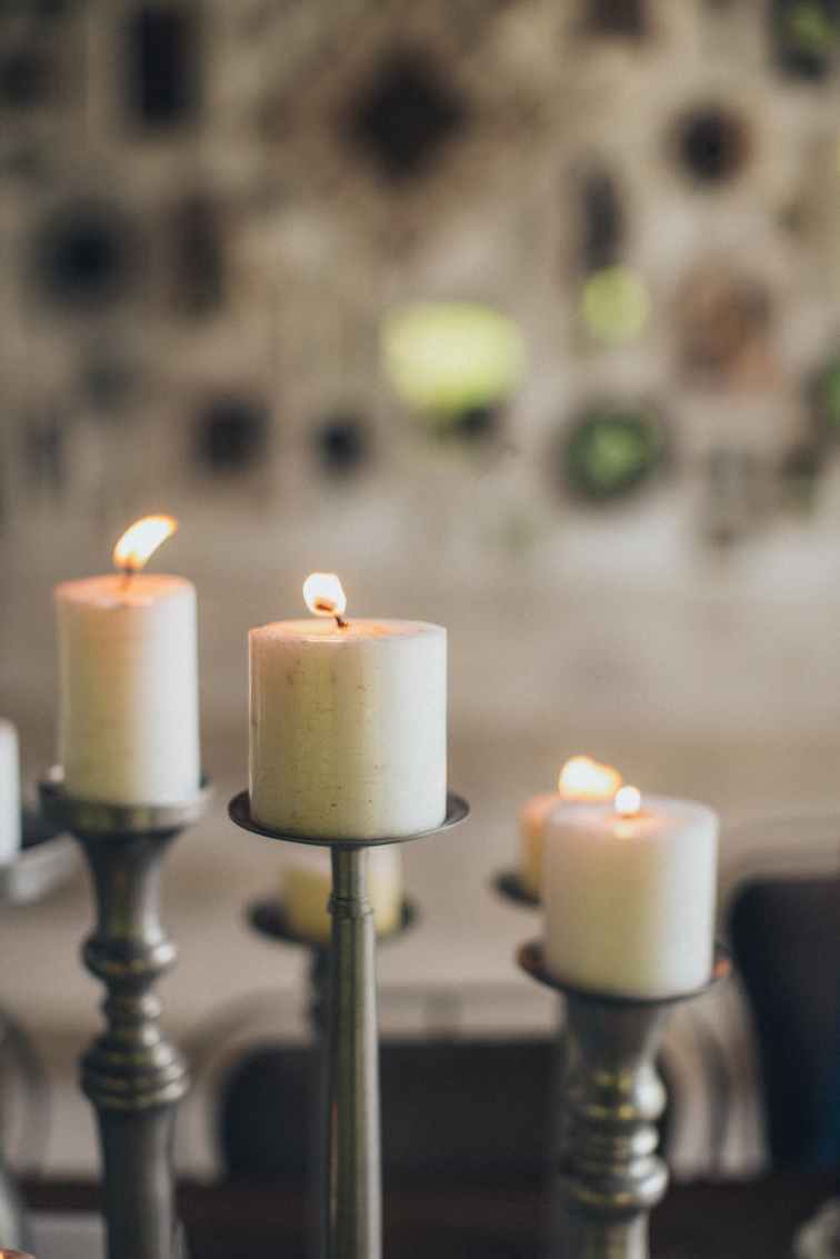 three lighted pillar candles